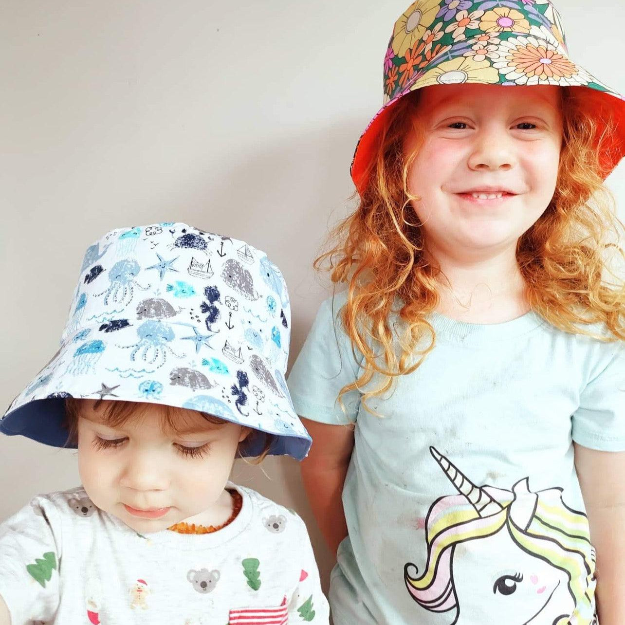 Yoho Baby & co. | Hand made by a Kiwi Mumma bucket hats for babies. Orange Blooms print