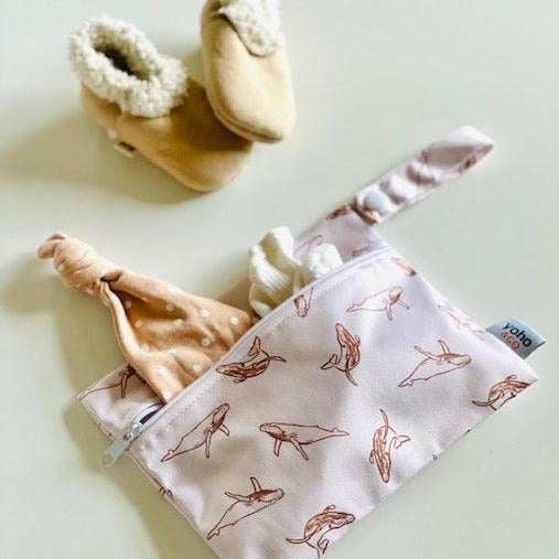 Yoho Baby & co. NZ Wet bags in 4 convenient sizes, for babies daycare, swim nappy, cloth nappies, snacks, breast pads and so much more! Toffee Whales Print